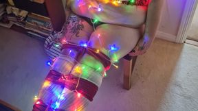 Miss K wrapped in Christmas lights