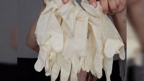 Miss Sara masturbates while using many pairs of latex gloves