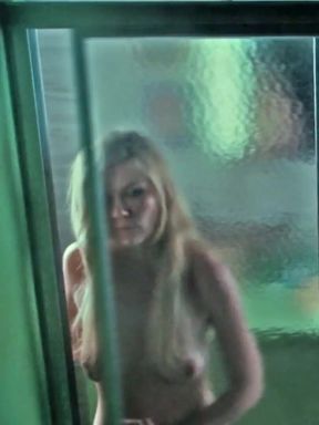 Slim celebrity Kirsten Dunst shows off her tits in a solo pose