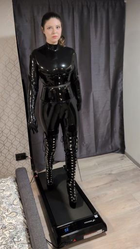 Fetish babe walks in high-heeled boots