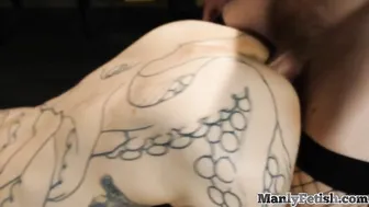 Handsome tattooed stud barebacks crossdresser in fishnets at the office