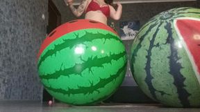 girl riding on 2watermelon beachballs