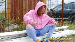 Girl with a hoodie pee trough her jeans