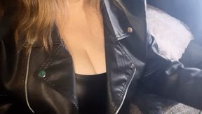 Smoking in a leather dress and jacket