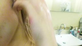 Gentle nude striptease and masturbation with orgasm in the bathroom. Close-up