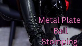 Stomping Balls Like They Deserve In Shiny Black Boots on Metal Plate