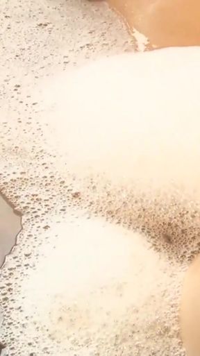 Epic moment from "This beautiful Asian lesbian with pierced nipples and lush lips gets a royal sex treatment in a jacuzzi"