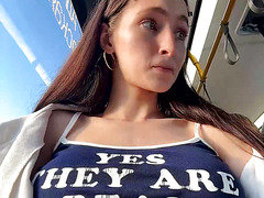 Playful Brunette Teasing with 'Yes They Are Real' Top on Public Transit & Outdoors