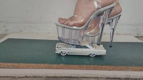 Giantess goddess Charlie Caroline Crushes a 1965 Ford Galaxie in big stripper heels with painted toenails close ground view
