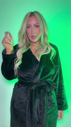 Blonde woman in robe pointing finger