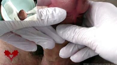 Nurse in white latex gloves gives a firm handjob during a medical examination