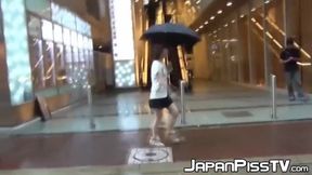 Young Japanese takes her panties off to pee in a coffee shop