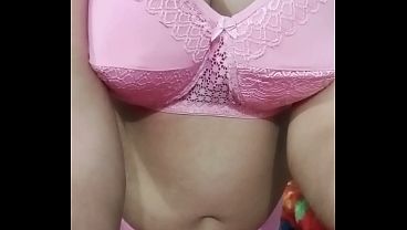 Indian Gay Crossdresser Gaurisissy showing and playing with her big boobs in pink honeymoon lingerie