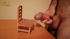 Handjob and cumshot on a small wood chair