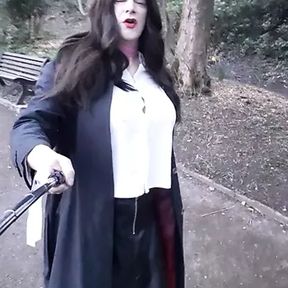 crossdresser wearing a short leather skirt walking in the park in Waterfoot Lancashire