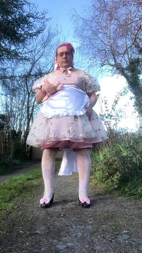 In a babydoll outfit to pee a second time in the diaper outside