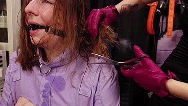 Slave girl hair cutting