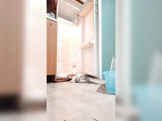 Transvestite cleans the fridge and eats his cum
