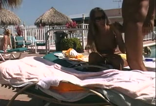 Naked light haired chick in sunglasses is fucked doggy on deck chair