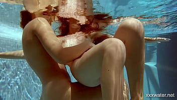 Two sultry sirens splash in scorching swimming waters, their bodies begging to be ravaged.