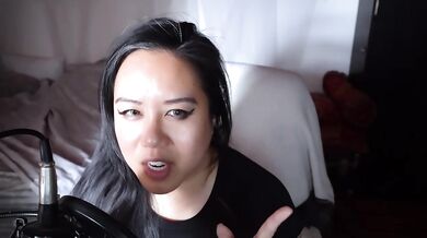 Teasing the camera after an interview asian milf dominatrix