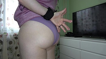 Anna is handcuffed and kneeling, showing her heels