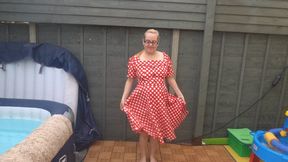 striptease in 50s red dress with stockings and suspenders