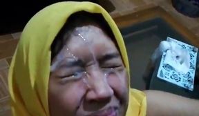 Indonesian Yellow Hijab Takes Big Facial Cum from Small Dick