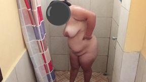 Taking a shower in a public restroom.
