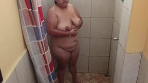 Taking a shower in a public restroom.