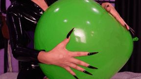 Playing with balloon in latex, riding it, and long nails scratching (mov)