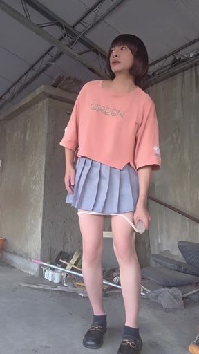 A Pleated Skirt Paired with White Underwear, and an Anal Plug Inserted on the Terrace