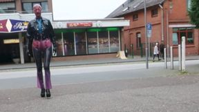 Pierced Latex Girl in Transparent Jeans, Stockings, Blouse, Jacket, Demask Corsett Mask and Gloves walks in the town with piercings rings hanging out & Butt Plug Part III