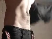Standing, undressing and pulling cock Fire Boy