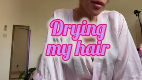 Just drying my hair… try not to stare too much