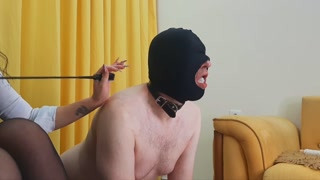 Dominatrix Nika feeds sperm to her slave. Two used condoms with sperm in the slave's mouth.