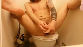 Horny FtM stretching his ass and pussy with a big dildo