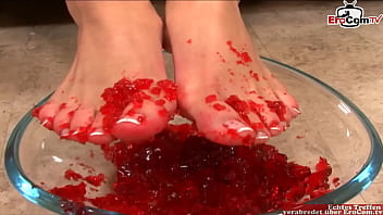 Brunette Teen play with her feet and gets a cumshot on it