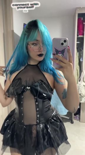Curvy young pro models futuristic fashion in a solo stand