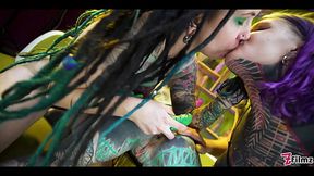 Tattooed babes lick each other's cunt and use big toys