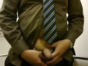 wank and cum in officewear at Singapore washroom