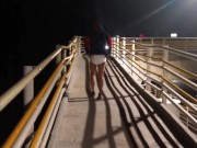 Man walks in a diaper across the public bridge