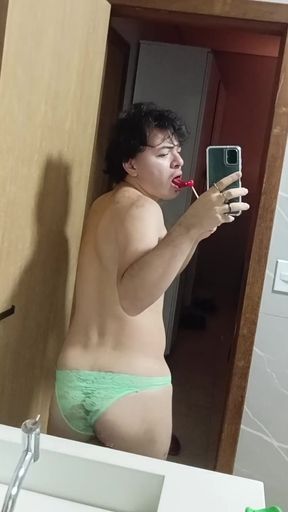 gay femboy sexy skirt lingerie and licking lollipop