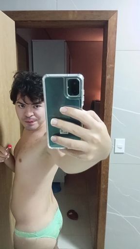 gay femboy sexy skirt lingerie and licking lollipop