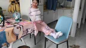 The straight arms of the girl with eyes were tied with silk to block her mouth ?Chinese Model)