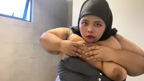 Hijabi sucking her own tits