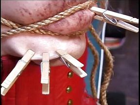 Girl in red getting tits roped and nipple pinched
