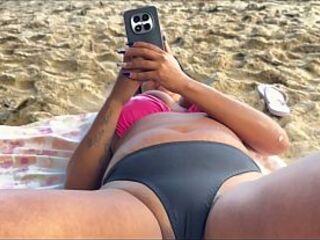 Squirting on the beach with the fisherman watching and thoroughly enjoying it.