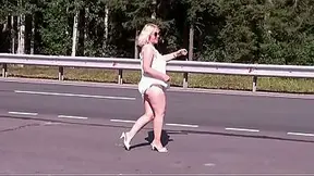Hot experienced lady with perfect jugs and thick natural booty teases in a car.