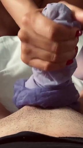 Adeline Murphy does a purple stockings footjob